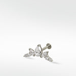 The white gold Crown Crawler earring featuring a cluster of brilliant pear, marquise, and round cut diamonds.