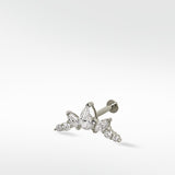 The white gold Crown Crawler earring featuring a cluster of brilliant pear, marquise, and round cut diamonds.