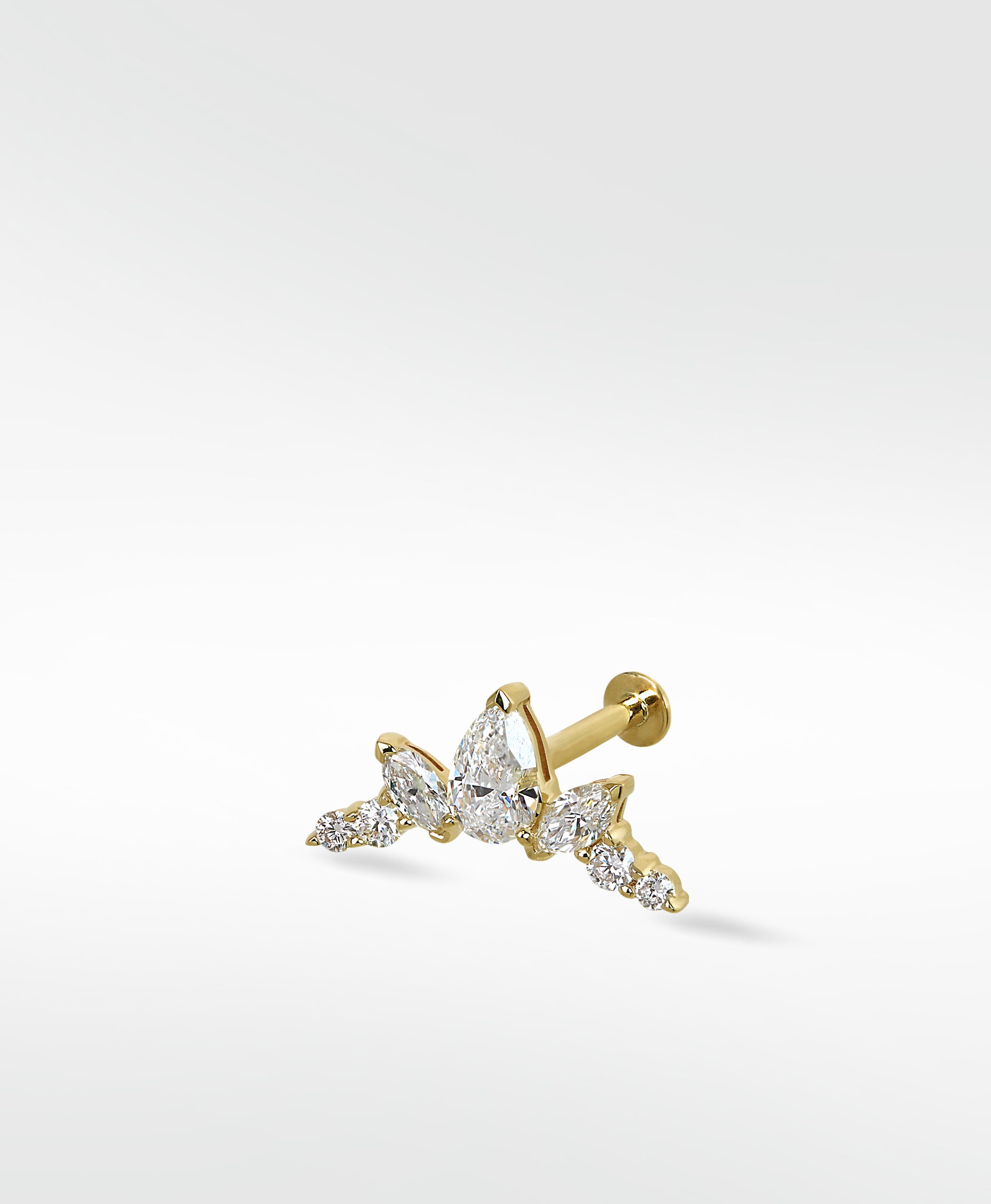 Lark & Berry's Crown Crawler earring in yellow gold featuring pear, marquise, and round diamonds.