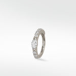 A Modernist Marquise Pave Hoop in white gold with a central marquise diamond and surrounding pavé stones.